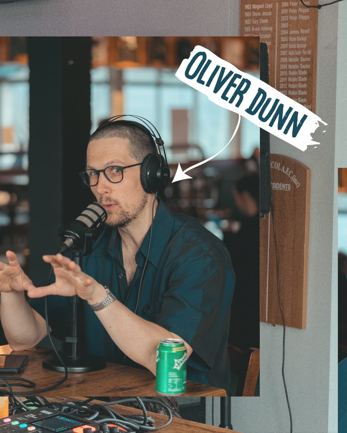 Oliver Dunn talking with both hands up