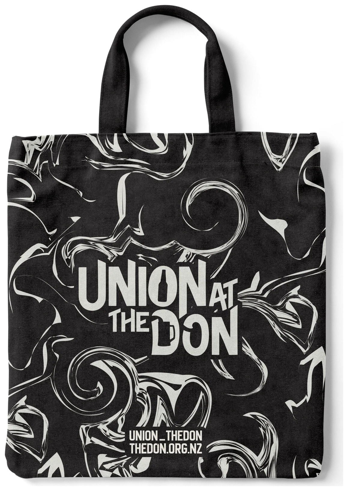 Black tote covered in white swirling linework